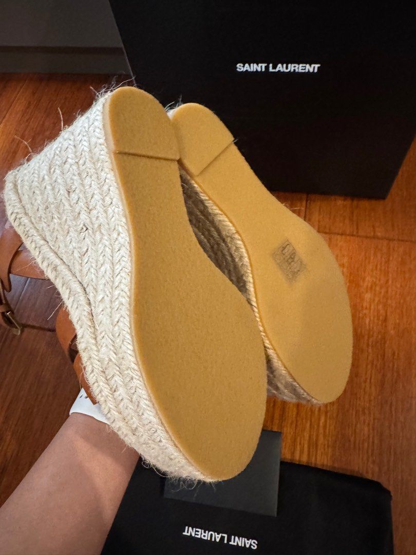 SAINT LAURENT Tribute 130 leather espadrilles (Category: Sneakers & Footwear) located in Muntinlupa City. Submitted by bagstagram (Listing ID 1347378025, Image 3). Description: Saint Laurent’s Tribute espadrilles are a warm-weather staple. Finished with 130 wedge heels, this style has been crafted in Spain in a timeless tan colorway for effortless sunshine chic. Upper: calf leather Lining: leather Sole: leather insole, rubber sole Toe shape: almo