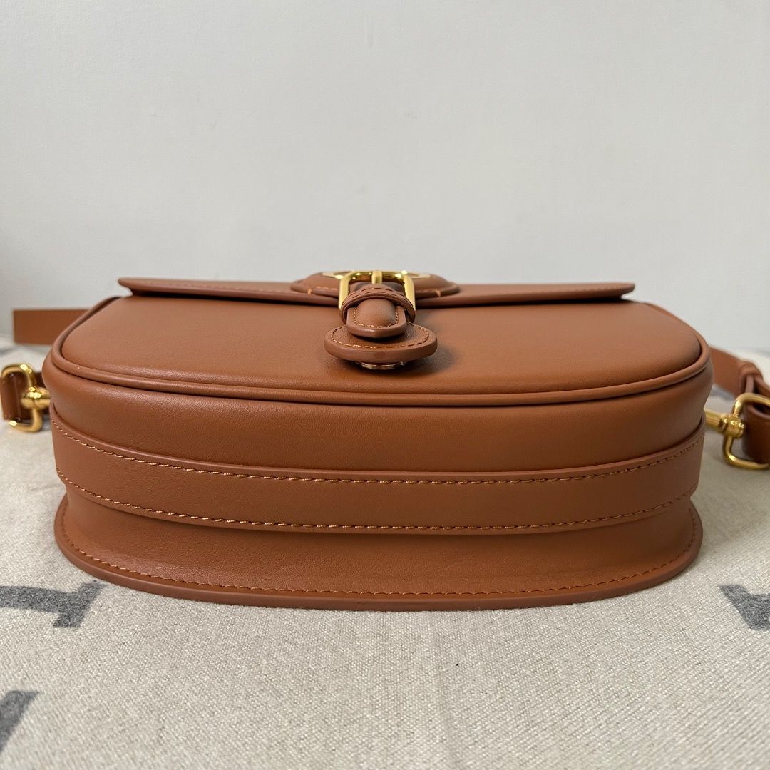 Dior Bobby Medium Bag Cognac-Colored Box Calfskin (Category: Luxury Bags & Wallets) located in Antipolo. Submitted by chanchimj (Listing ID 1338780309, Image 3). Description: The medium silhouette is crafted from cognac-colored box calfskin with a supple suede calfskin interior, and is enhanced by antique gold-finish metal hardware. Its removable and adjustable shoulder strap has a military-inspired buckle and allows it to be carried by hand, wor