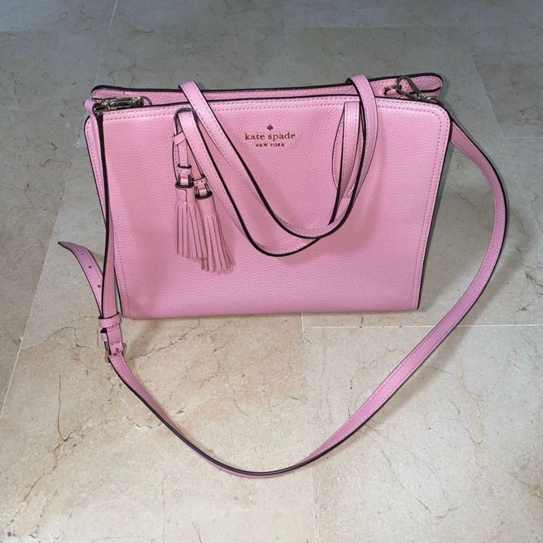 Kate Spade Rowe Leather Top Zip Satchel Bag Medium Bright Carnation Pink (Category: Bags & Wallets) located in Singapore. Submitted by stairskitty (Listing ID 1347584532, Image 1). Description: Kate Spade Rowe Leather Top Zip Satchel Bag Medium Bright Carnation Pink. Great condition. The smaller version is currently listed at StockX for USD238. Selling only SGD150 (now at SGD50) for this medium size. Beautiful pink tumbled leather..