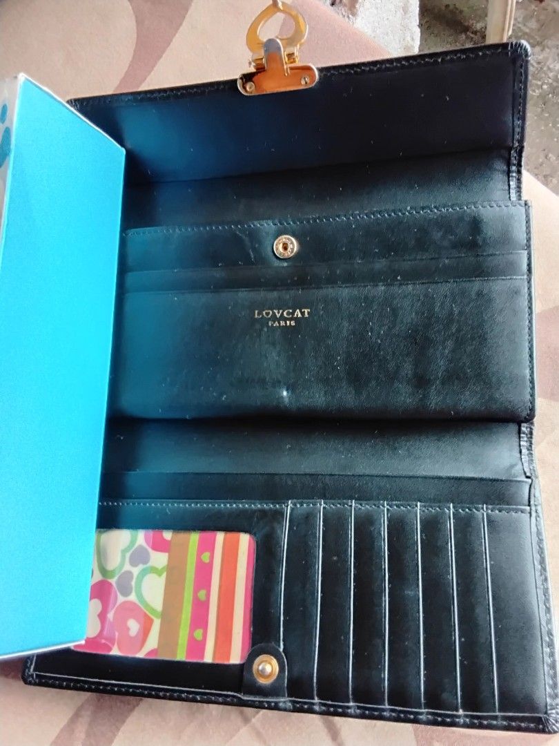LOVCAT WALLET (Category: Wallets & Card holders) located in Bulacan. Submitted by MariaRegon (Listing ID 1347561465, Image 3). Description: Leather. Natural light. Day light shot. As is. Mode of Payment : GCASH.