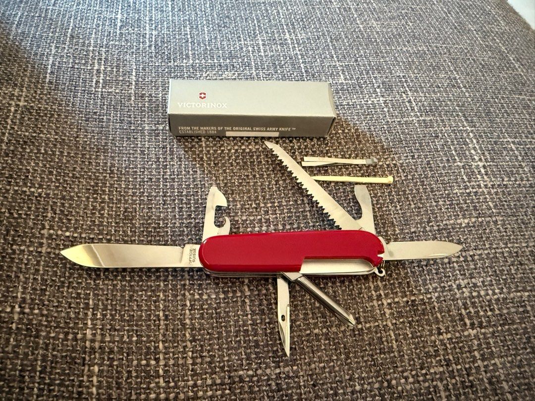 Victorinox Hiker SAK (Category: Hiking & Camping) located in Makati City. Submitted by see5o5 (Listing ID 1347503752, Image 2). Description: Victorinox Hiker Swiss Army Knife. Brand new with box. TOOLS Blade, large / Blade, small / Reamer, punch and sewing awl / Wood saw / Phillips screwdriver 1/2 / Key ring / Tweezers / Toothpick / Can opener / Bottle opener / Screwdriver 3 mm / Screwdriver 6 mm / Wire stripper DIMENSIONS Height: 16 mm Length: 9