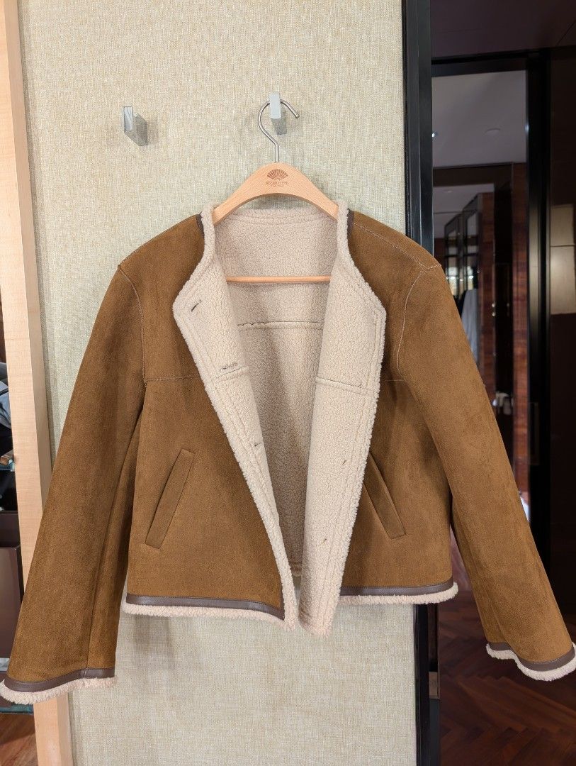 Winter shearling jacket (Category: Coats, Jackets and Outerwear) located in Singapore. Submitted by redtrucks (Listing ID 1347545484, Image 1). Description: Brand new and unworn Fits xs-s size comfortably Stay warm while looking stylish, looks great buttoned up or hanging open Self collect and serangoon gardens Goods sold non returnable.