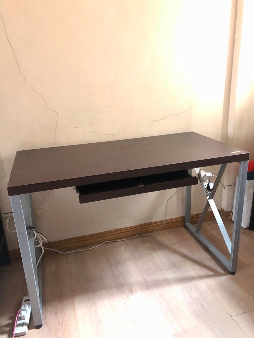 PRELOVED SIGMA Computer & Office Desk (Category: Office Furniture & Fixtures) located in Manila. Submitted by _bizzd_ (Listing ID 1329518388, Image 2). Description: Preloved/SecondHand SIGMA Computer & Office Desk 120x60x78.5cm Darkwood and Silver Actual photos (2nd-6th photo) 90% good working condition RFS: Moving Out +SF c/o Buyer Location: San Juan City MOP: 50% DP, BDO/BPI.
