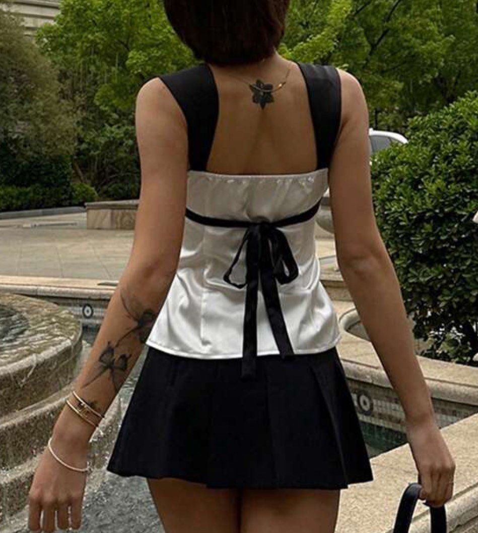 Satin black and white two-tone tie top (Category: Sleeveless) located in Makati City. Submitted by sundaystash88 (Listing ID 1347757528, Image 2). Description: Never used XS on tag.