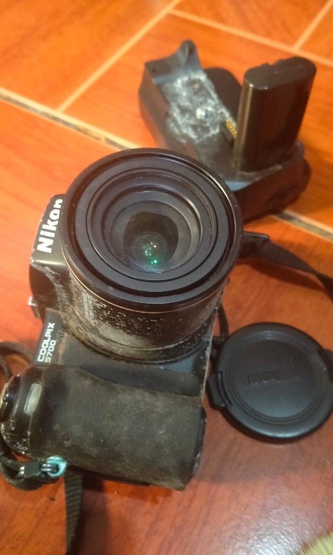 [Broken] Nikon Coolpix 5700 with MB-E5700 Battery Grip (Category: Cameras) located in Pasay City. Submitted by silentbear_c00b58 (Listing ID 1347853296, Image 2). Description: Broken Nikon Coolpix 5700 with MB-E5700 Battery Grip and Original Strap (For Parts or Repair) Selling a Nikon Coolpix 5700 digital camera with the MB-E5700 battery grip and original strap. The unit is broken and being sold as-is for parts or repair. Condition: - Camera: Bro