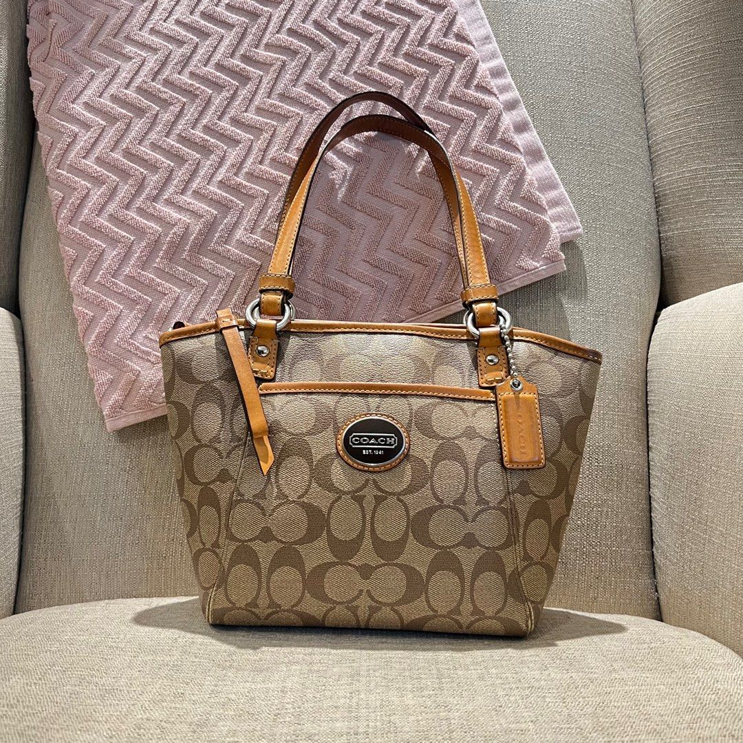 Coach Mini Tote kili bag (Category: Luxury Bags & Wallets) located in Paranaque City. Submitted by missb1001 (Listing ID 1347985287, Image 1). Description: Please check photos carefully! Issues: Signs of use on the handles rubbings on the bag’s bottom corners Missing long strap Size: L 10” x H 8” Strap drop: approx 8.5” Shipping c/o buyer Mop: gcash or bank transfer This is a pre-loved bag, meaning it’s not brand new, so manage your expectations.
