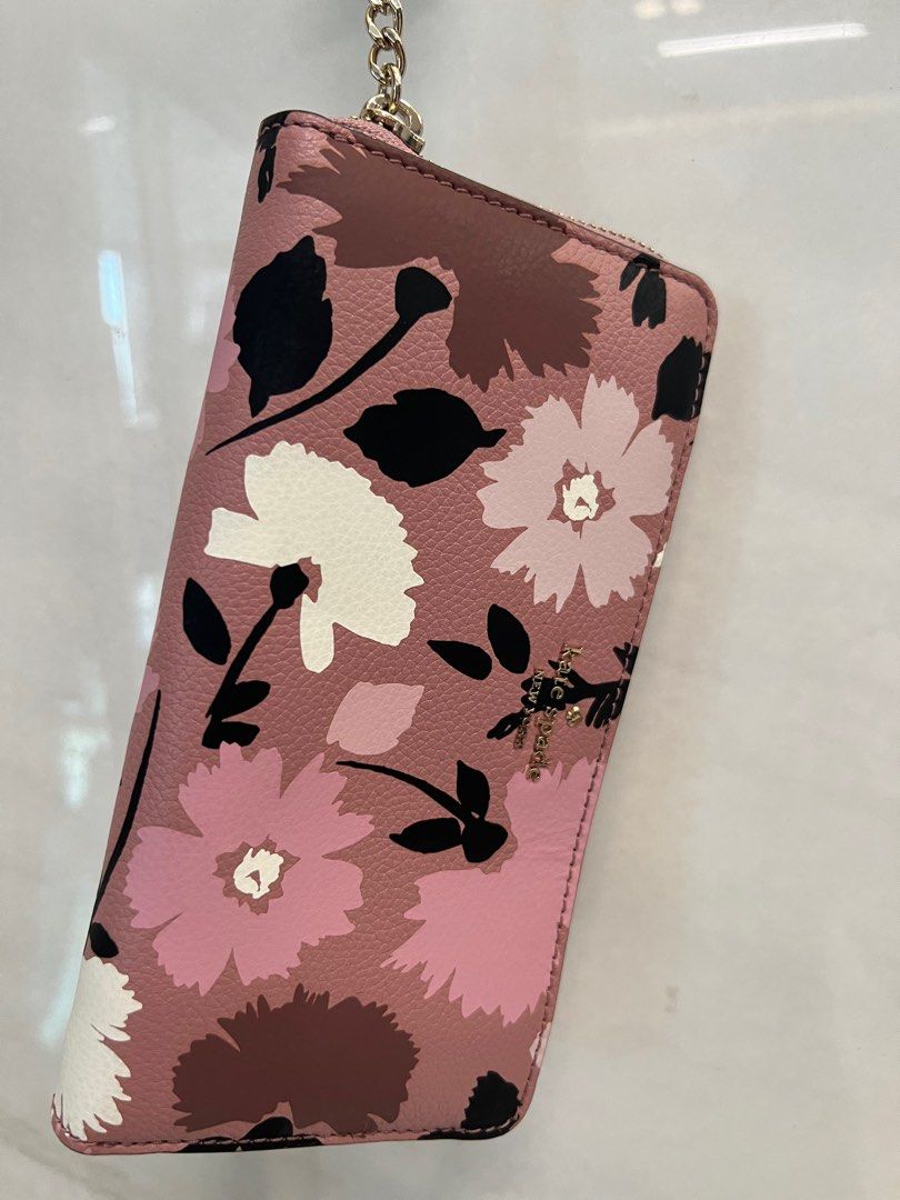 Kate Spade Floral Long Wallet with Keychain (Category: Purses & Pouches) located in Manila. Submitted by declutterwithme08 (Listing ID 1347974881, Image 2). Description: - bought from the States - guarenteed authentic - never used.
