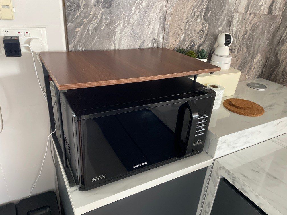 Microwave Table (Category: Food Organisation & Storage) located in Singapore. Submitted by tlidd (Listing ID 1347873006, Image 1). Description: Like new. Good for additional storage area if you wanna put things on top of your microwave. Cash and carry.