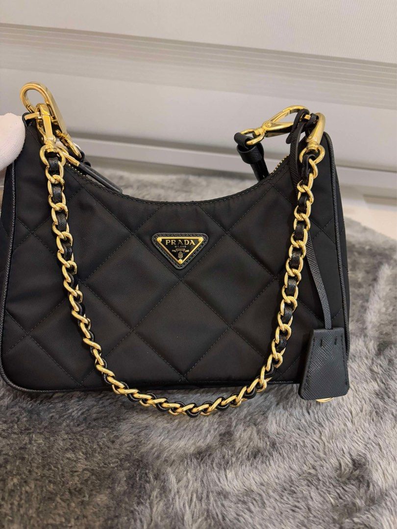 Prada Re-Edition 1995 Chaîne Re-Nylon mini-bag (Category: Luxury Bags & Wallets) located in Las Pinas. Submitted by Le.Pattie.Luxe (Listing ID 1347857796, Image 3). Description: 💯% authentic 𝐏𝐫𝐚𝐝𝐚 𝐑𝐞-𝐄𝐝𝐢𝐭𝐢𝐨𝐧 𝟏𝟗𝟗𝟓 𝐐𝐮𝐢𝐥𝐭𝐞𝐝 𝐍𝐲𝐥𝐨𝐧 𝐂𝐡𝐚𝐢𝐧 𝐁𝐚𝐠 🖤𝐏𝐡𝐩 𝟔𝟗.𝟓𝐤🖤 ▪️Color: black ▪️Almost new condition ▪️Microchip ▪️W/ chain strap & adjustable saffiano leather strap ▪️Inclusions: clochette, dustbag, & 2 straps 💯% a