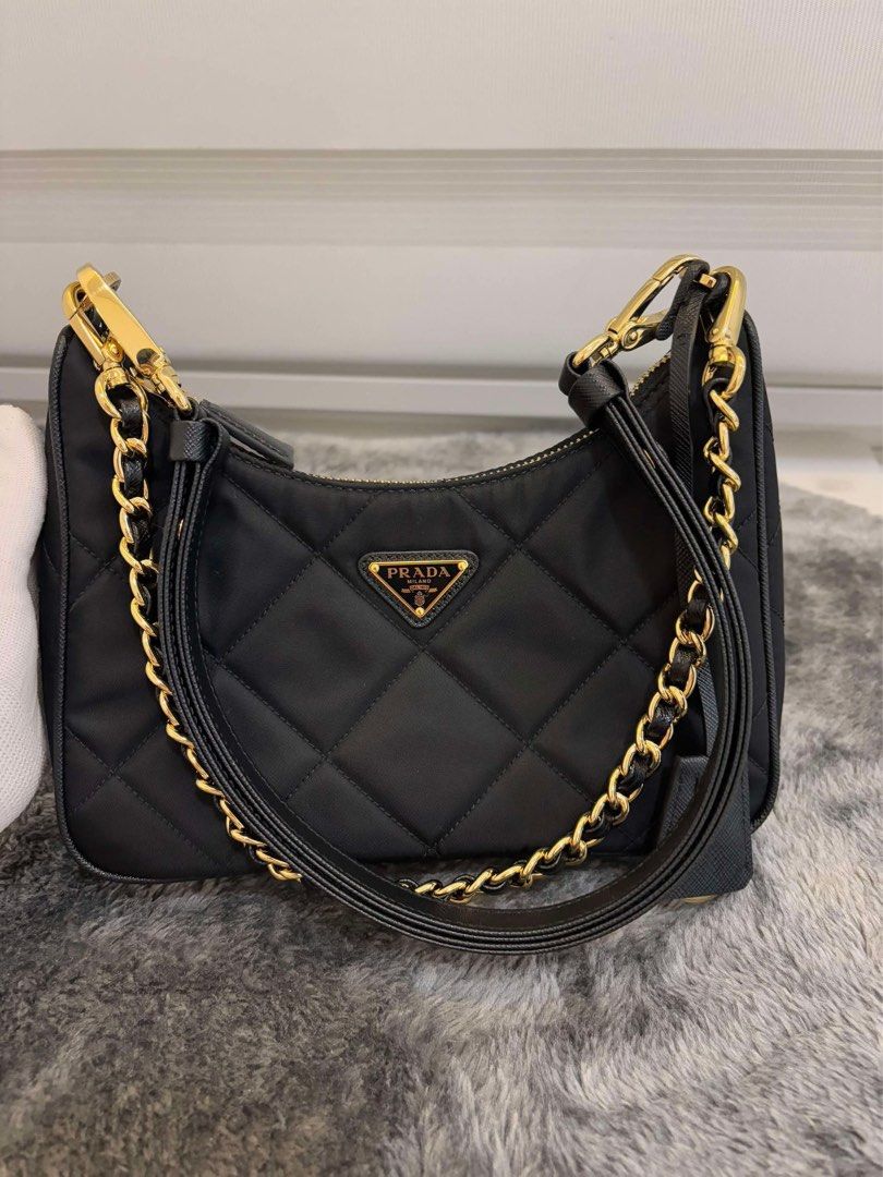 Prada Re-Edition 1995 Chaîne Re-Nylon mini-bag (Category: Luxury Bags & Wallets) located in Las Pinas. Submitted by Le.Pattie.Luxe (Listing ID 1347857796, Image 2). Description: 💯% authentic 𝐏𝐫𝐚𝐝𝐚 𝐑𝐞-𝐄𝐝𝐢𝐭𝐢𝐨𝐧 𝟏𝟗𝟗𝟓 𝐐𝐮𝐢𝐥𝐭𝐞𝐝 𝐍𝐲𝐥𝐨𝐧 𝐂𝐡𝐚𝐢𝐧 𝐁𝐚𝐠 🖤𝐏𝐡𝐩 𝟔𝟗.𝟓𝐤🖤 ▪️Color: black ▪️Almost new condition ▪️Microchip ▪️W/ chain strap & adjustable saffiano leather strap ▪️Inclusions: clochette, dustbag, & 2 straps 💯% a
