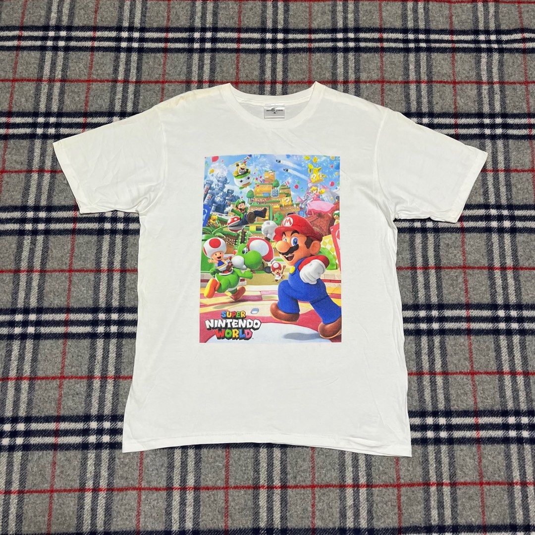 Super Mario by Universal Studios Japan (Category: Tshirts & Polo Shirts ) located in Marikina City. Submitted by wayupcollective (Listing ID 1347856652, Image 1). Description: Super Mario by Universal Studios Japan Size M Excellent condition Flaw: washable stains Measurement Length: 27” Width: 19” .