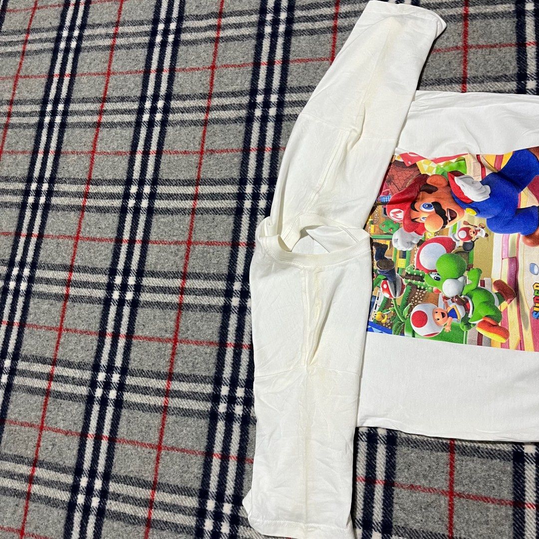 Super Mario by Universal Studios Japan (Category: Tshirts & Polo Shirts ) located in Marikina City. Submitted by wayupcollective (Listing ID 1347856652, Image 3). Description: Super Mario by Universal Studios Japan Size M Excellent condition Flaw: washable stains Measurement Length: 27” Width: 19” .