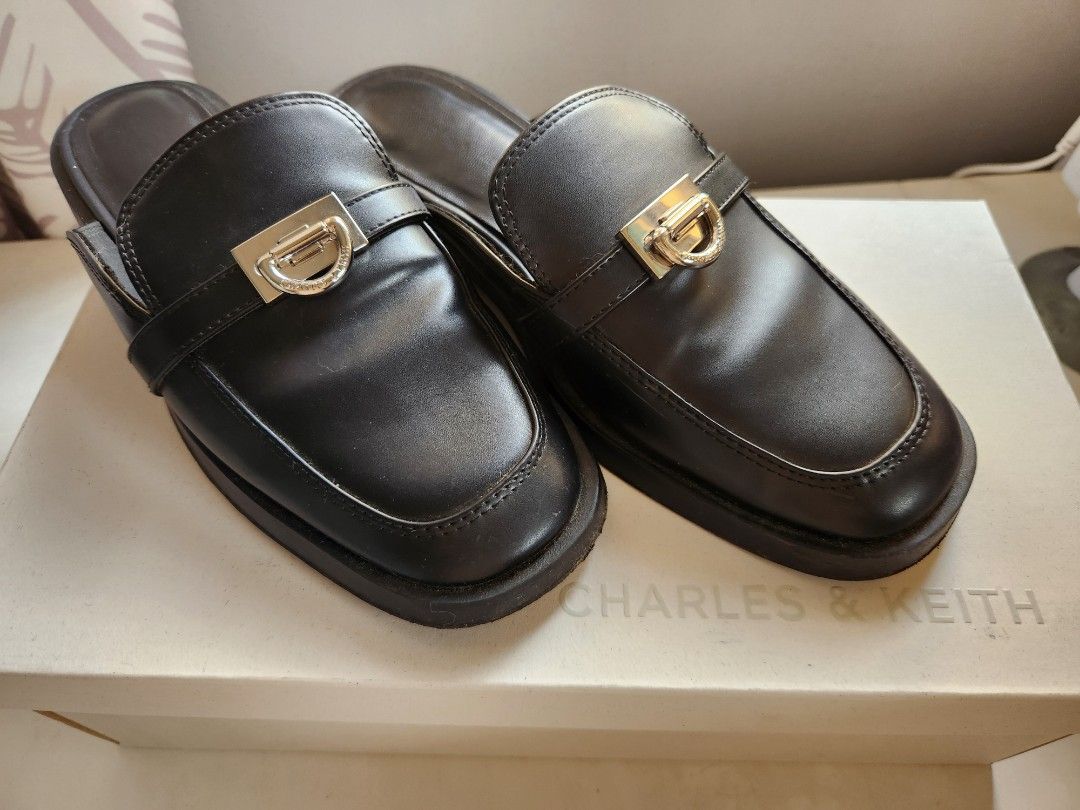 Charles & Keith Black Leather Mules (Category: Loafers) located in Quezon City. Submitted by bea_beee (Listing ID 1348043469, Image 1). Description: Charles & Keith Black Leather Mules Slightly used Still in excellent condition Size: 35 RFS: Decluttering.