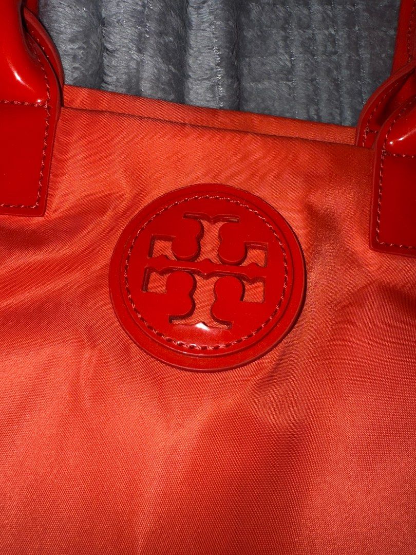 Tory Burch Ella Tote Small (Category: Luxury Bags & Wallets) located in Cabanatuan. Submitted by jaycapatrisha (Listing ID 1348032692, Image 3). Description: Tory Burch Ella Small Tote Bag Leather Nylon Lightweight Patent Logo Satchel Zip A lightweight tote bag neatly sized to fit all your everyday essentials. Crafted in durable nylon accented with patent leather trim. Great minimalist tote. Versatile— everyday wear, office, beach - Colour: Elect