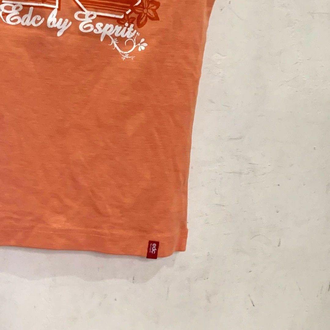 y2k esprit orange tank top ruched sleeve (Category: Sleeveless) located in Arayat. Submitted by capymelon (Listing ID 1348200457, Image 3). Description: size : small-medium dimension: 13.5" width 20" length stretch issue : slightly faded color washed and ready to wear !! message me for other details ♡ pls read ↓ 📍 pampanga mop : gcash courier : j&t (sf is 70-90) pls do not make an offer if you cannot handle the sf all items are negotiable but no