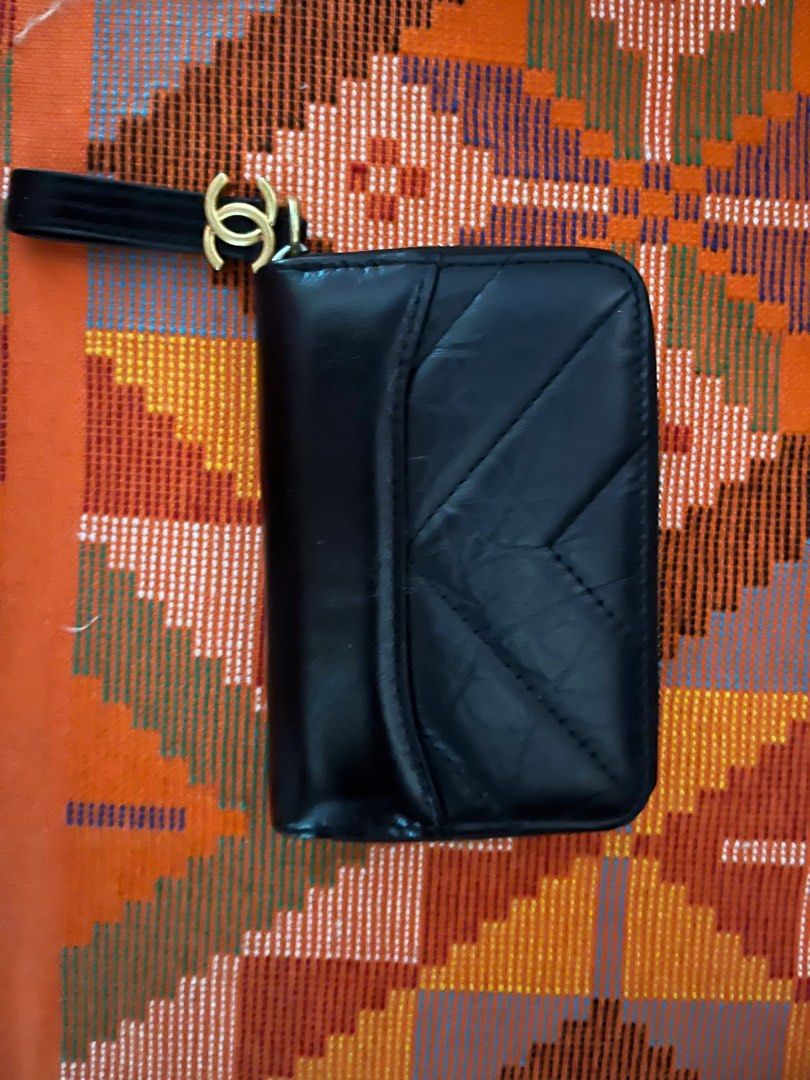 Zipped genuine leather card holder / wallet (Category: Purses & Pouches) located in Makati City. Submitted by gapofa (Listing ID 1348180986, Image 1). Description: Excellent condition - fabric interior. designed like the Ch*n*l boy collection No box..
