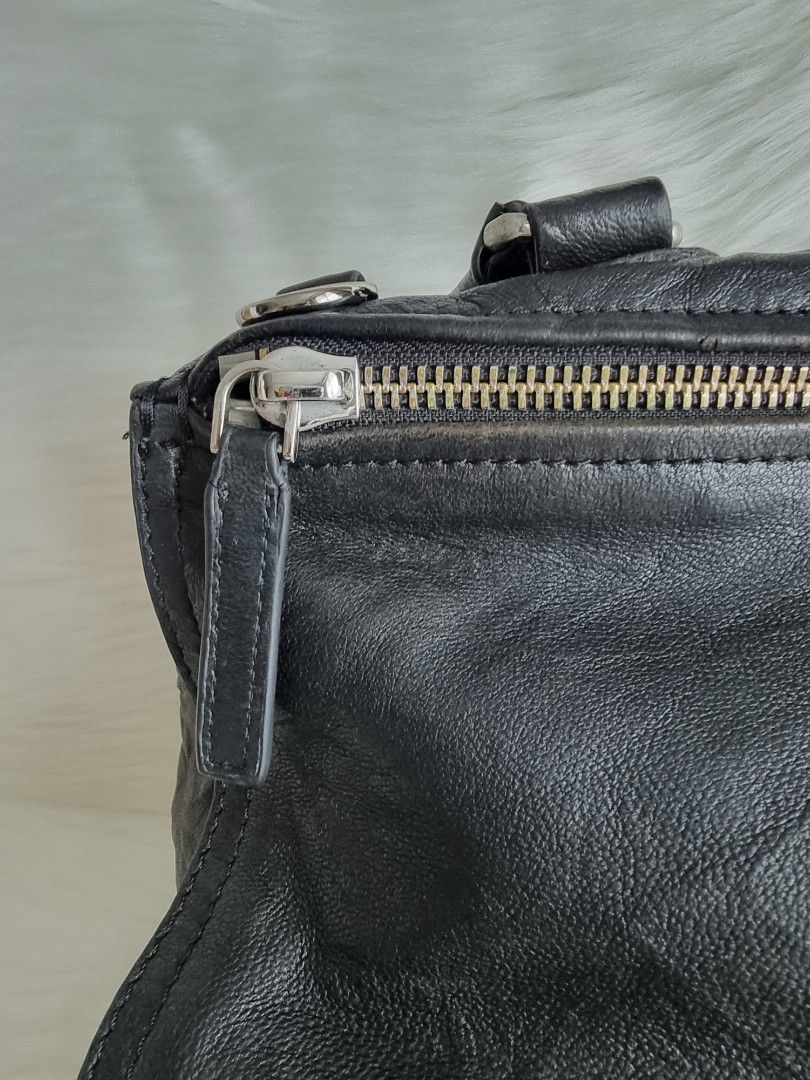 Givenchy (Category: Luxury Bags & Wallets) located in Manila. Submitted by facet.ornament (Listing ID 1348388308, Image 3). Description: • Material: Black wrinkled sheepskin ("Old Pepe") leather • Dimensions: 10.5" L x 6" W x 6" H • Interior Pockets: ¾Single zip pocket, one flat pocket, one cell phone pocket • Handles: Single rolled leather top handle and a long leather strap • Handle Drop: 6" and 23" • Closure/Opening: Zip closure • Interior Lin