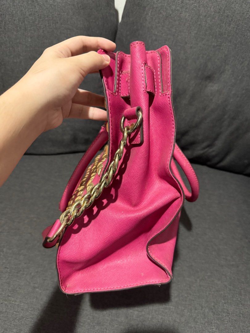 Michael Kors (MK) Leather Studded Pink Bag (Category: Luxury Bags & Wallets) located in Manila. Submitted by pheta (Listing ID 1348398286, Image 3). Description: RFS: Decluttering Bag has been deformed a bit (refer to the back pictures) Authentic MK Leather Studded Large North South Hamilton Tote.