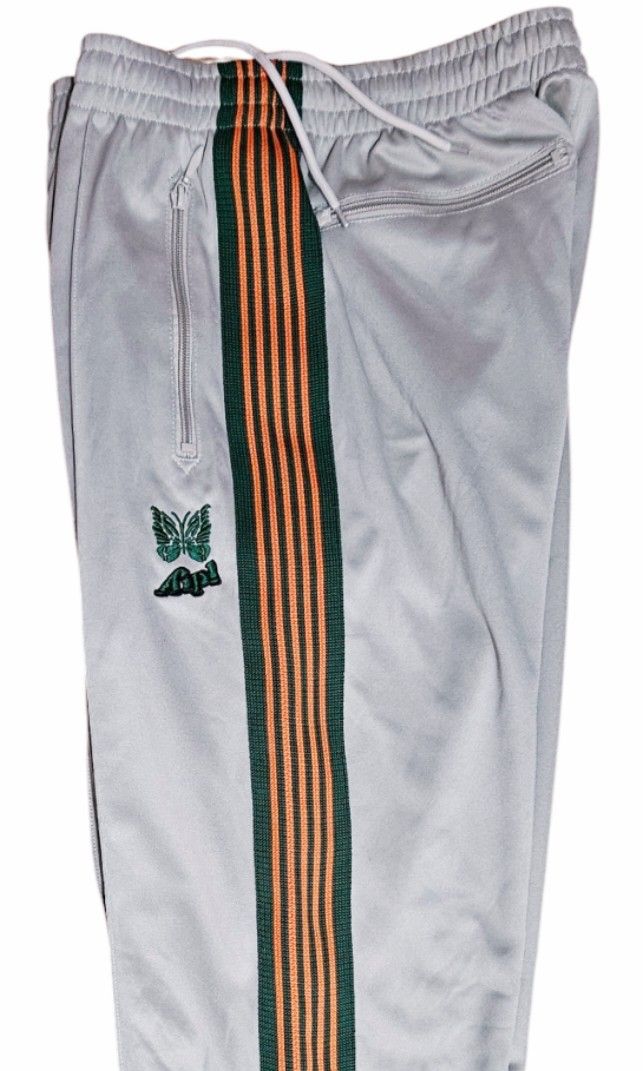 Needles x AIPL trackpants (Category: Joggers) located in Las Pinas. Submitted by 05.11minimalist (Listing ID 1348269911, Image 2). Description: Needles x Aipl trackpants. Light brown. Made in Japan. Size L on tag. Dimensions: 32-34" waist, 40" length. No runs, rips or holes. In very good condition. Please do not make any OFFER if you have no intentions of buying. Do not BUY if in doubt. Actual pics of items posted/listed. No Reservation. No Retur