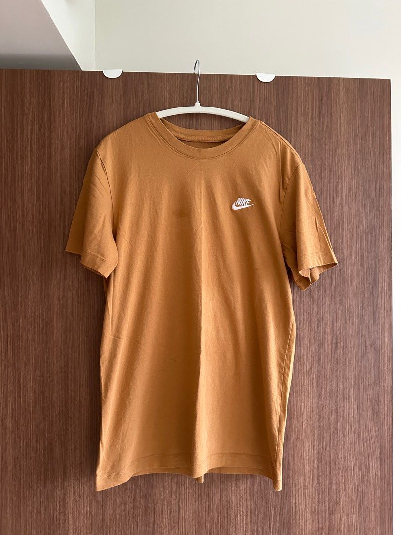 Nike Basic Tshirt (Category: Shirts) located in Singapore. Submitted by haeseam (Listing ID 1348260402, Image 1). Description: Color: Caramel Worn once..