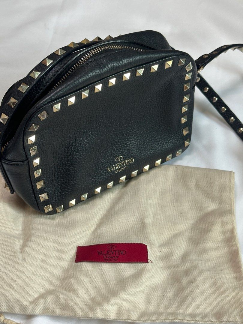 Valentino Garavani Rockstud Camera Bag (Category: Luxury Bags & Wallets) located in Manila. Submitted by shop.avl (Listing ID 1348259172, Image 1). Description: Black Valentino Garavani with card and dustbag Complete studs with signs of usage no flaws! Color Black RFS: Decluttering.