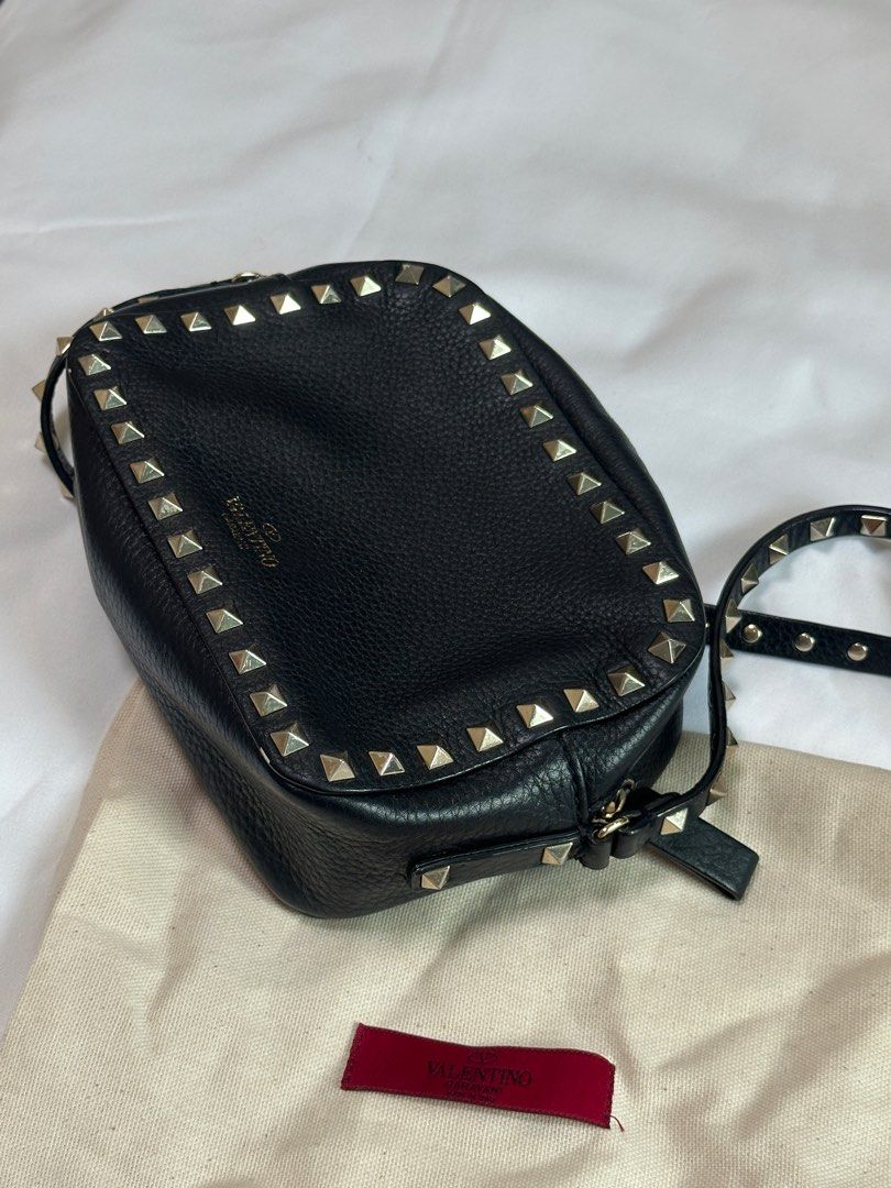 Valentino Garavani Rockstud Camera Bag (Category: Luxury Bags & Wallets) located in Manila. Submitted by shop.avl (Listing ID 1348259172, Image 3). Description: Black Valentino Garavani with card and dustbag Complete studs with signs of usage no flaws! Color Black RFS: Decluttering.