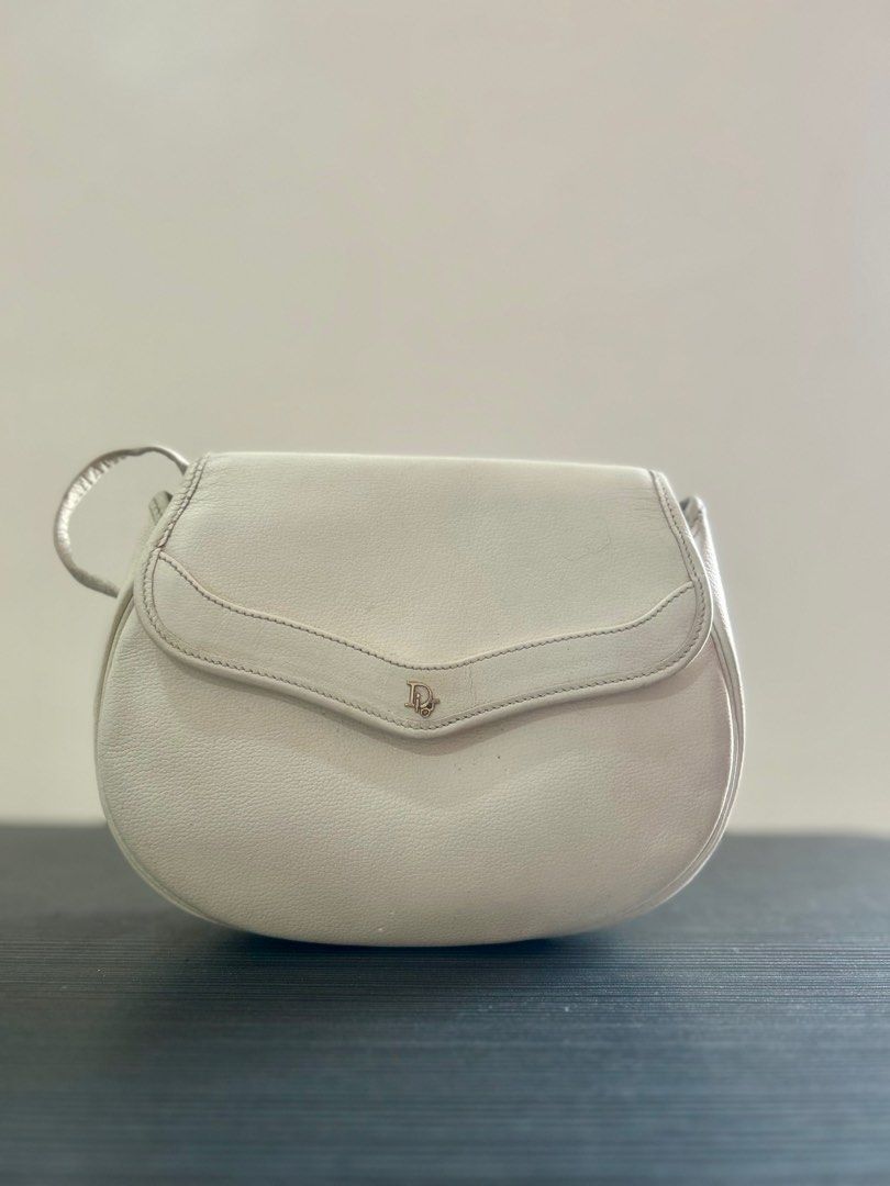 Vintage dior mini crossbody (Category: Luxury Bags & Wallets) located in Baguio. Submitted by saleonstuffs (Listing ID 1348257608, Image 1). Description: With cracks on bag and strap Retouched Dot marka on body Clean interior.
