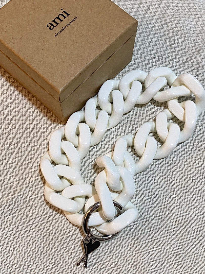 AMI De Coeur Necklace (Category: Necklaces) located in Pasig City. Submitted by halffullbutneverfull (Listing ID 1345019738, Image 3). Description: AMI Alexandre Mattiussi Ami De Coeur necklace Curb chain acrylic in white Logo charm in silver-tone Comes with box.