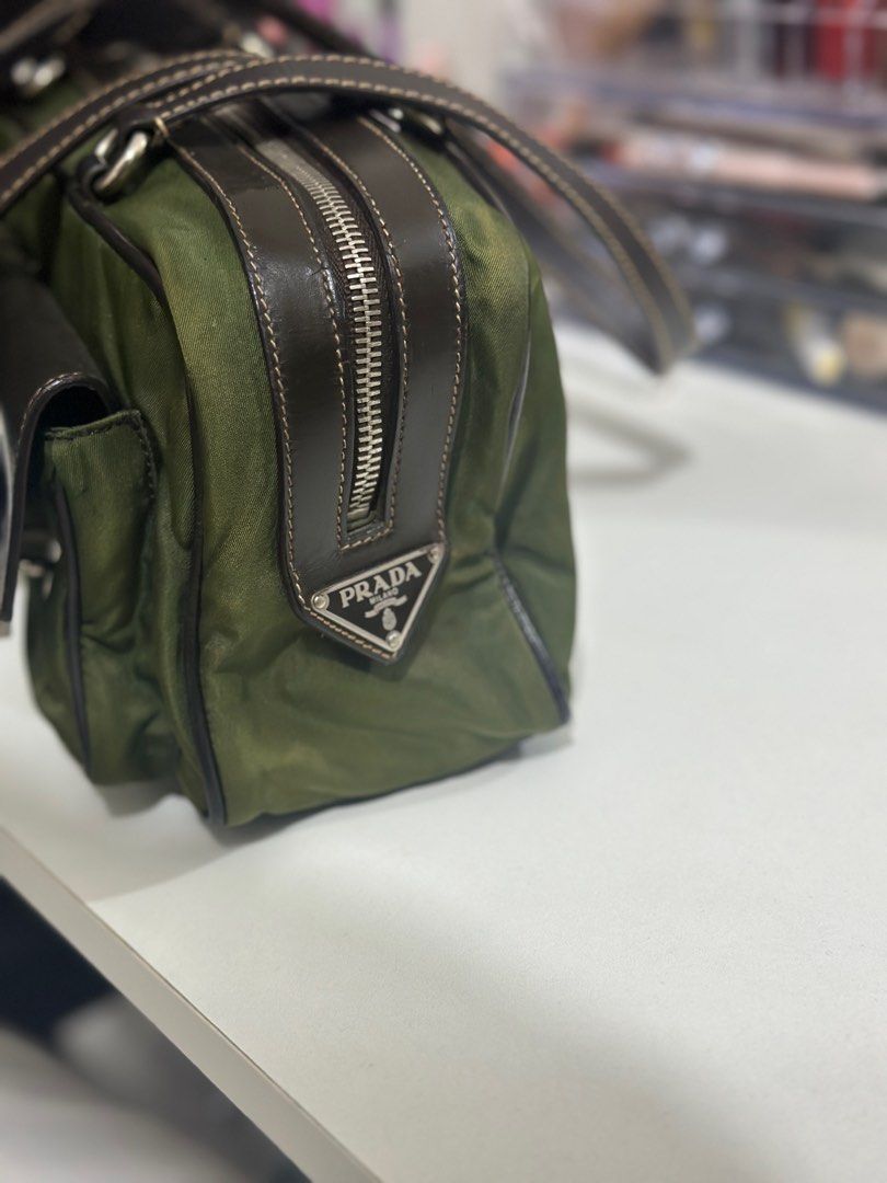 Authentic Prada Vintage Tessuto Nylon Buckle Shoulder Bag (Category: Luxury Bags & Wallets) located in Cagayan de Oro. Submitted by jammydean (Listing ID 1345049247, Image 3). Description: Selling my well loved prada tessuto buckle shoulder bag Originally bought around 30k+ in Japan, selling low because I no longer have the dustbag and the care card. I dont use this either because I always bring a laptop with me. Flaws: minimal discoloration on t