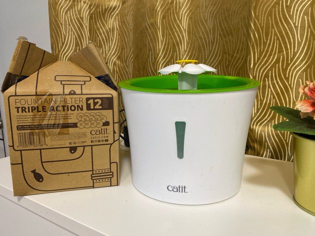 Catit Water Fountain and Filter (Category: Homes & Other Pet Accessories) located in Bacoor. Submitted by ampetvet (Listing ID 1345053292, Image 2). Description: Catit 3L Flower Water Fountain for dogs and cats - used - 200 Catit Fountain Filter Triple Action - set of 2 filters - 200 php 1 box with 12 packs of Catit Fountain Filter Triple Action - unopened box - 2,000php Everything: 17 filters and water fountain - 2,300php with 2 free big collaps