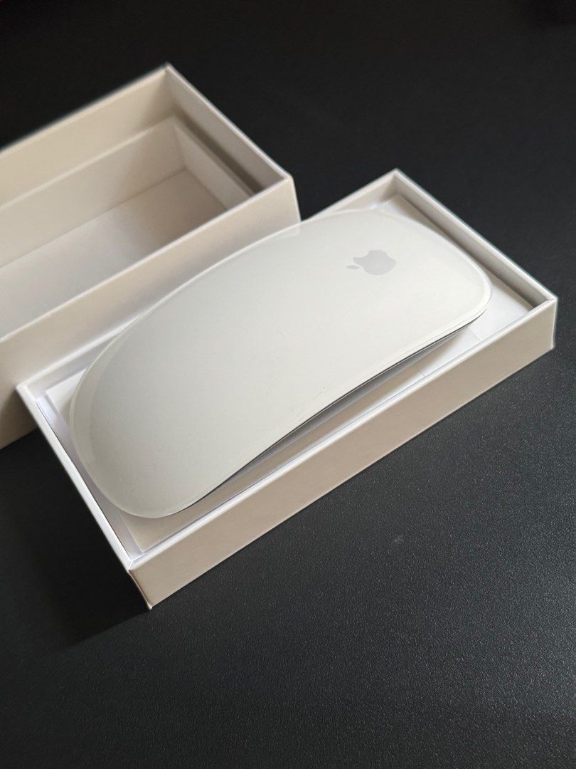 Magic Mouse (Category: Mouse & Mousepads) located in Singapore. Submitted by lstmark (Listing ID 1344947583, Image 2). Description: Practically brand new Magic Mouse. Only used for ~10 mins max. Tested and still working I noticed a light scratch at the top, must have happened when I was moving it around briefly. See red circle in the last picture .
