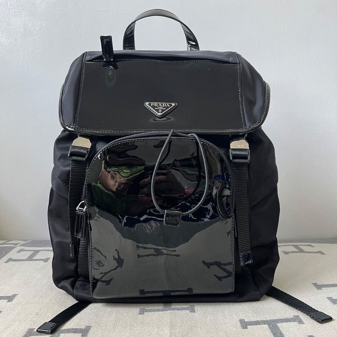 Prada Tessuto Nylon Patent Backpack 2VZ135 (Category: Luxury Bags & Wallets) located in Antipolo. Submitted by chanchimj (Listing ID 1334480226, Image 1). Description: Prada Re-Nylon with shiny leather backpack Integrating innovative recycled nylon fabric Re-Nylon with shiny leather, highlighting the fusion charm of contemporary fashion and pragmatism Large capacity, fashionable and versatile, easy to use for daily life and travel 2VZ135 Size: wi