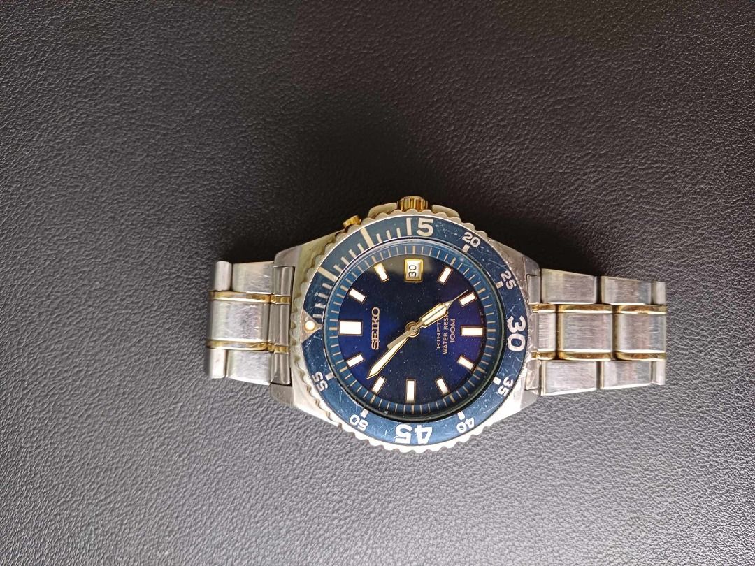 SEIKO KINETIC 100M SKA009P (Category: Luxury Watches) located in Manila. Submitted by timearcph (Listing ID 1345093649, Image 2). Description: SEIKO KINETIC 100M SKA009P Description: Rare hard to find Seiko kinetic 100m 5M62-0A10, SKA009P, two tone, blue dial(japan), blue/gold bezel insert, gold/ stainless bracelet and good lume. PRICE: 8,000 PHP Brand: Seiko Condition: Conservative rating of 9/10. Set: Comes watch only SHIPPING: - Open to shippi