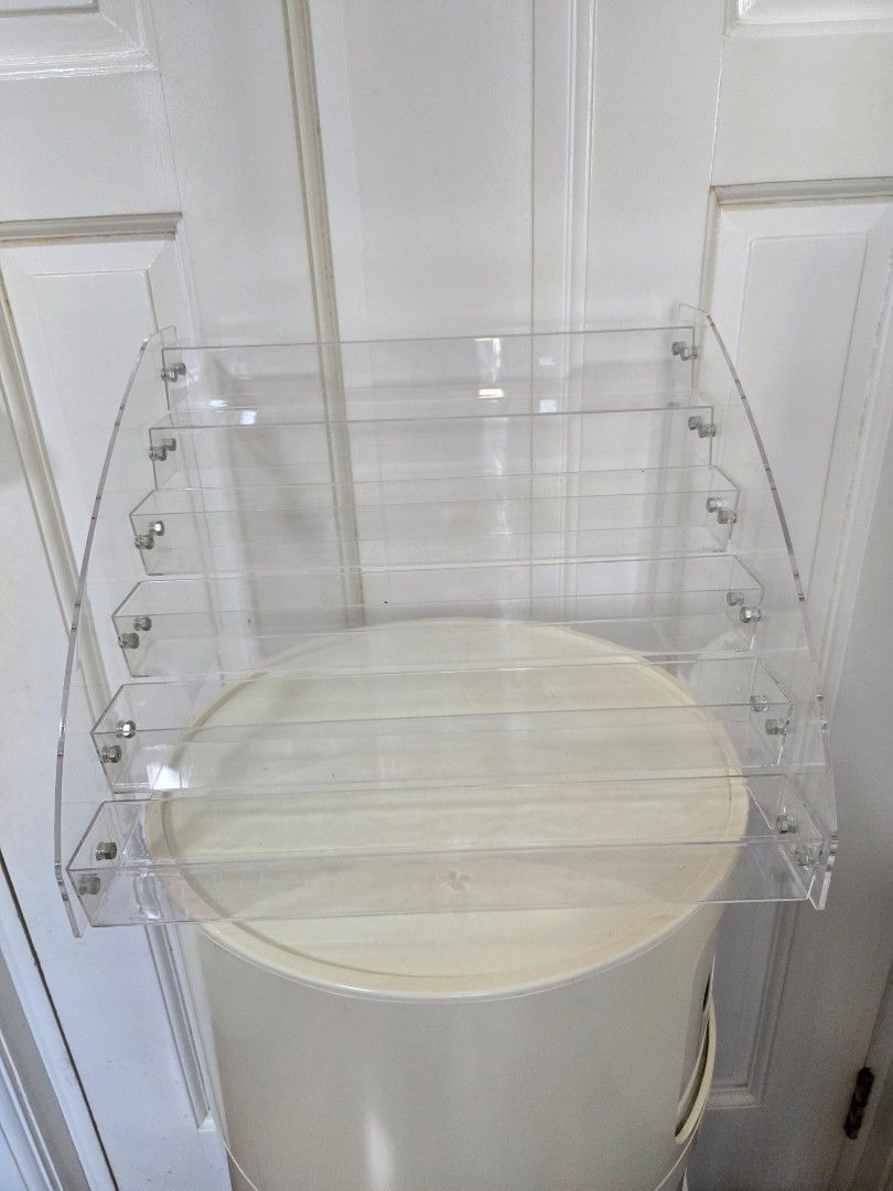 Acrylic Stand Rack (Category: Storage Boxes & Baskets) located in Malabon City. Submitted by emmashappymommy (Listing ID 1348450713, Image 2). Description: 6-Tier Acrylic Stand Rack Material: Acrylic Color: Clear Dimensions: 12"x10.5"x8.5" (LWH) Condition: Lightly used. Used as display stand RFS: Decluttering MOP: Gcash Pick up Point: Potrero Malabon.