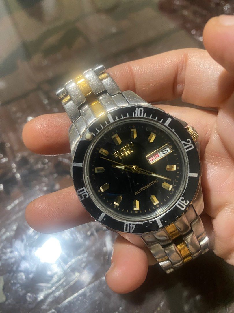 Elgin Steel Automatic Two Toned Men’s Kinetic Watch (Category: Men's Watches) located in Manila. Submitted by roseluxuryitems (Listing ID 1348581843, Image 2). Description: Elgin Steel Automatic Two Toned Men’s Kinetic Watch Good working condition 165 ft Y676A Japan made .