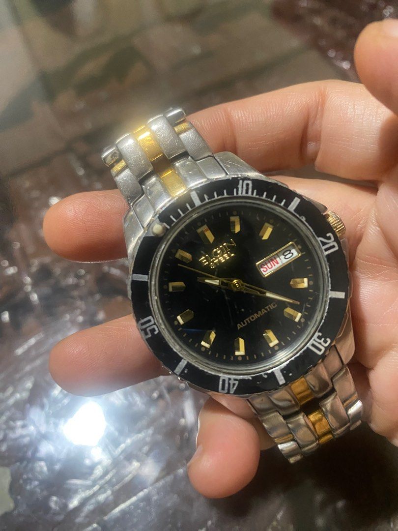 Elgin Steel Automatic Two Toned Men’s Kinetic Watch (Category: Men's Watches) located in Manila. Submitted by roseluxuryitems (Listing ID 1348581843, Image 1). Description: Elgin Steel Automatic Two Toned Men’s Kinetic Watch Good working condition 165 ft Y676A Japan made .