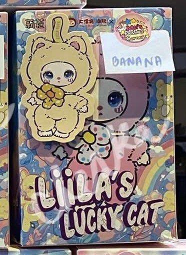 Liila Lucky Cat V1 (BANANA) (Category: Designer & Blind Box Toys) located in Rizal. Submitted by xiaoneeeee37477 (Listing ID 1343936593, Image 1). Description: ON HAND - 750 each Sold: - Fuchsia - Galaxy - latte - lemon - peach - Grape - Mint Available: - Banana .