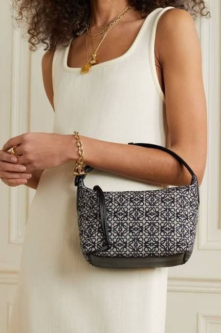 Loewe Cubi Small Anagram Jacquard Navy/Black Bag (Category: Luxury Bags & Wallets) located in Antipolo. Submitted by chanchimj (Listing ID 1348493779, Image 2). Description: Anagram canvas jacquard and calfskin with herringbone cotton canvas lining and gold-tone hardware Made in Spain Top zip closure with extended calfskin pull One main compartment Interior slip pocket Debossed Anagram on side Measures approx 20 cmW x 17 cmH x 13 cmD Adjustable t