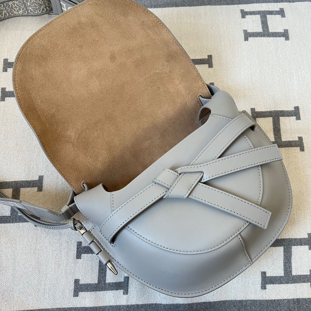 Loewe Gate Small Dual Gray Leather Sling Bag (Category: Luxury Bags & Wallets) located in Antipolo. Submitted by chanchimj (Listing ID 1348550176, Image 3). Description: This small version is crafted in soft calfskin. Shoulder or crossbody carry Adjustable calfskin and LOEWE jacquard shoulder strap with slider buckle fastening Height (cm) : 19 Width (cm) : 25 Depth (cm) : 11.5.