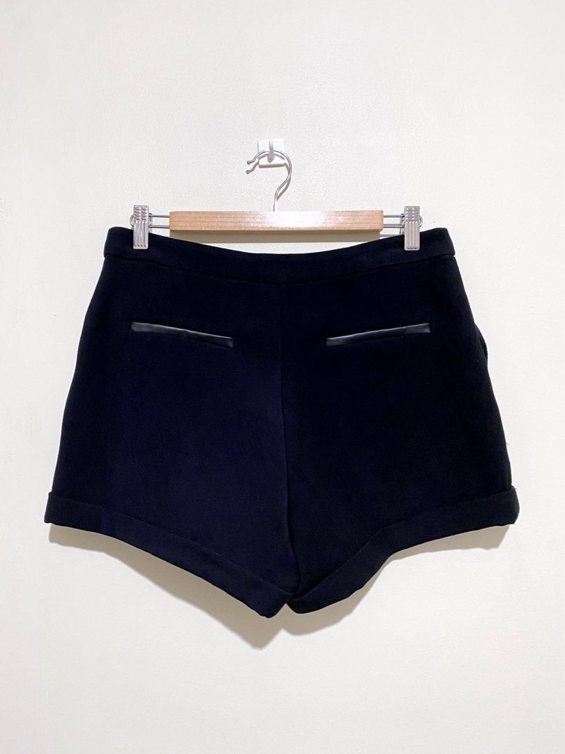 Mango Casual Basic Black Front Zip Shorts (Category: Shorts) located in Manila. Submitted by simoonie (Listing ID 1348524394, Image 3). Description: Mango Casual shorts: basic minimalist style, mid rise, in black color, 2 side pockets, hidden front zip closure, back faux leather decorated details. Store bought.✨ Shorts is in general very good condition except for the faux leather material which is flaking off - hence the low price. 😁 please chec