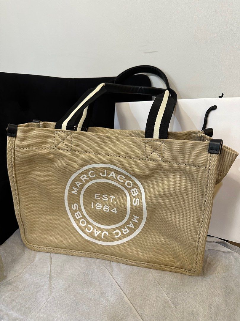 Marc Jacobs Canvas Signet Tote Medium (Category: Luxury Bags & Wallets) located in Pasig City. Submitted by iamloveluxe (Listing ID 1348446770, Image 1). Description: SRP ₱12,500 Bought in Japan.