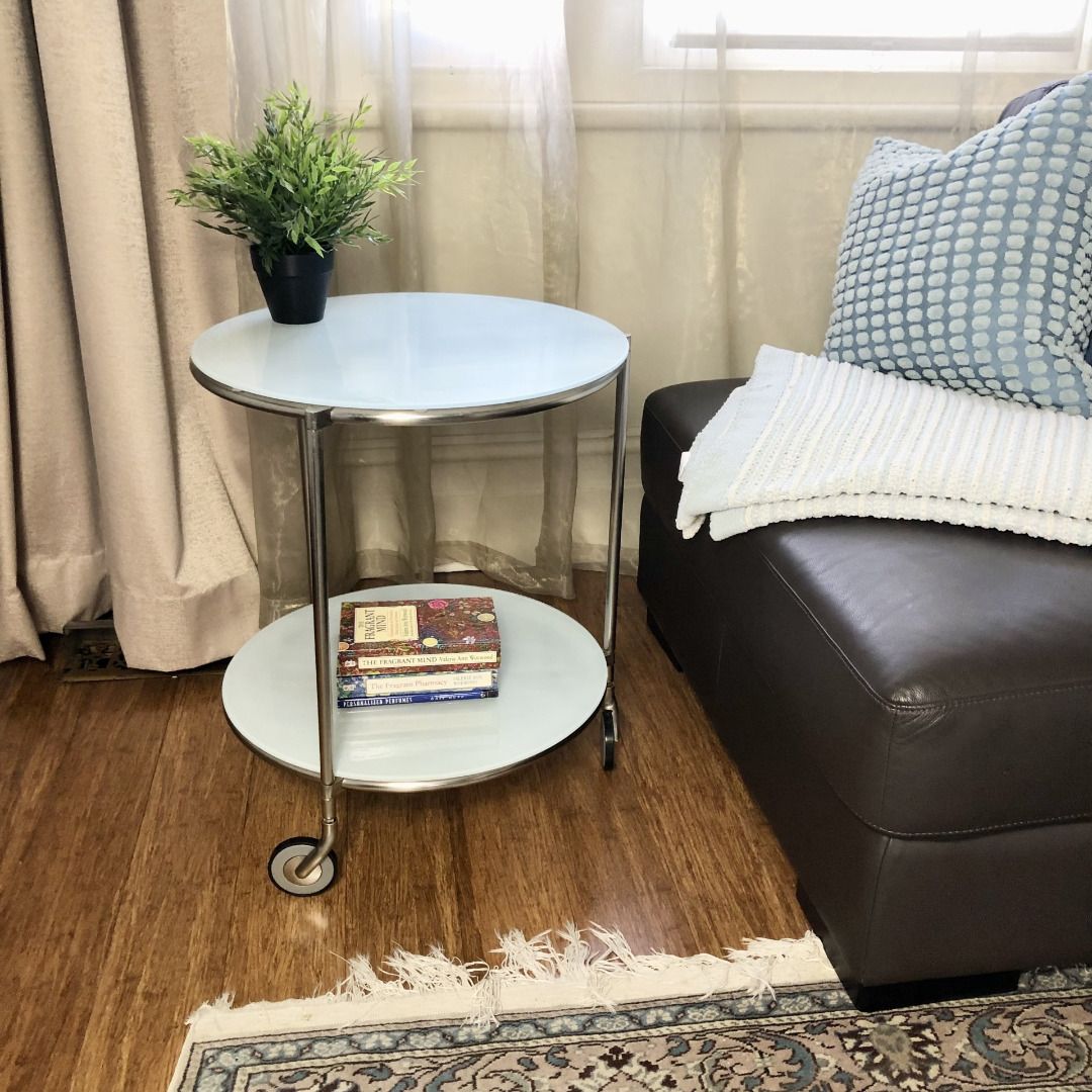 50cm Vintage IKEA Strind Side Table (Category: Furniture) located in North Melbourne. Submitted by thriftologymelbourne (Listing ID 1348670054, Image 2). Description: 💎Designed in the 1990’s by Ehlen Johansson for IKEA. This iconic mobile side table/drinks trolley is a testament to modern design principles, demonstrating effortless functionality whilst adding a distinct appeal to any Melbourne home interior. 🏗Materials: Steel frame and glass 📐