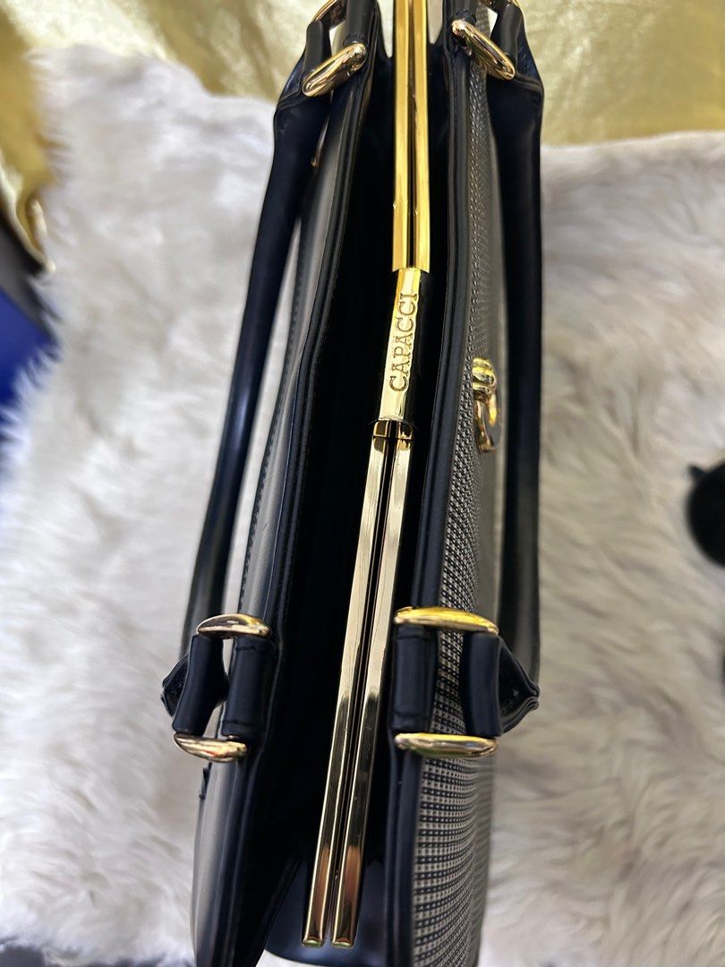 Capacci Kiss Lock Structured Bag (Category: Luxury Bags & Wallets) located in Manila. Submitted by leapmoonlight (Listing ID 1348708222, Image 3). Description: Coded with etiquette. Good for events. Shala bag With no flaws outside. Signs of use only. flaws inside (see pics for reference) For used item, please manage expectations and color may vary due to lifhting Mop: Gcash Gotyme Bdo Bpi.