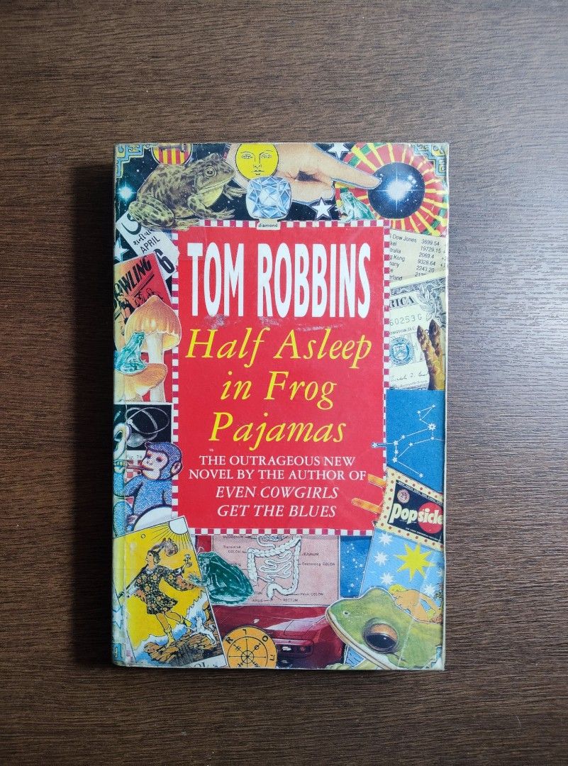Half Asleep in Frog Pajamas | Tom Robbins (Category: Storybooks) located in Paranaque City. Submitted by unravelled (Listing ID 1348767778, Image 1). Description: Half Asleep in Frog Pajamas | Tom Robbins Softbound Condition: 6/10 Plastic covered but not taped affixed to the inside cardboard. Cover has some slight creases, which is why I wrapped it in plastic Spine is creased Frankly, it's criminal how so few know Tom Robbins and his works..
