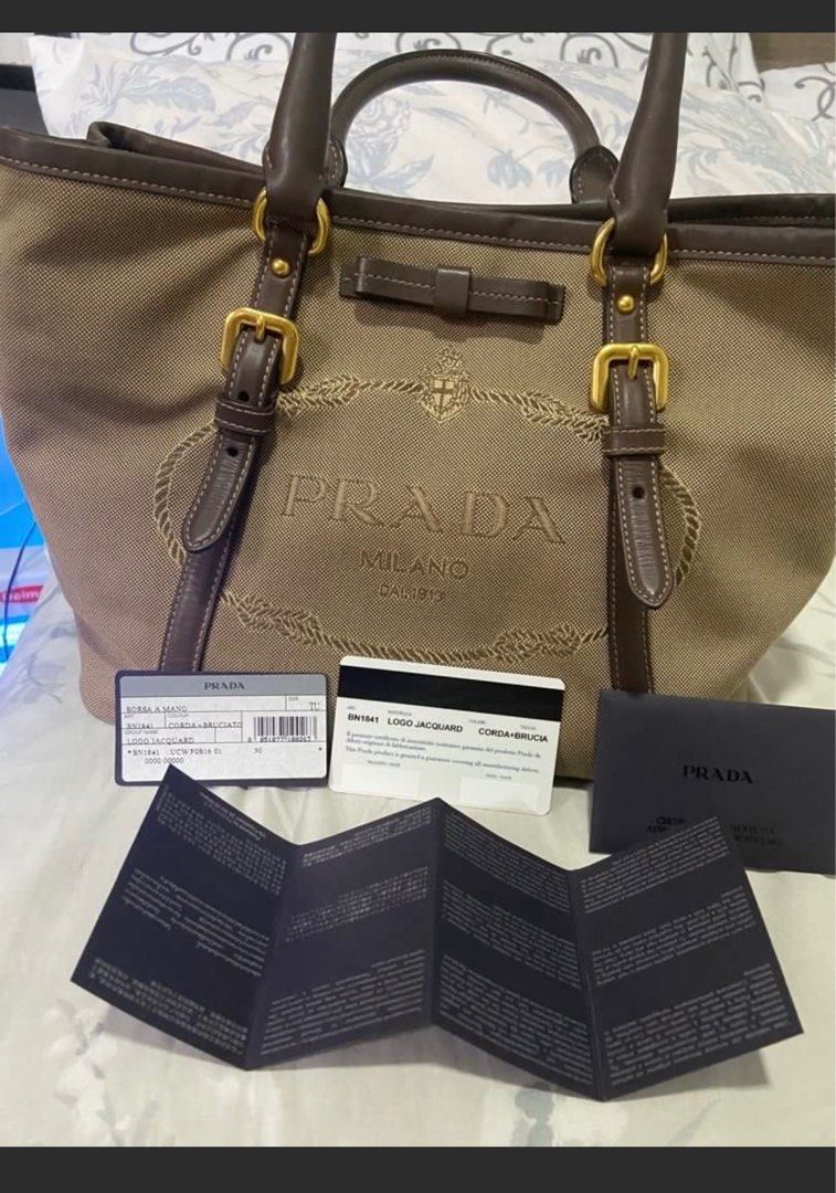 Prada Tessuto Nylon (Category: Luxury Bags & Wallets) located in Quezon City. Submitted by mypersonalstuff_10 (Listing ID 1348642615, Image 2). Description: 💯 % Authentic Prada logo Jacquard. Two way bag. Can be worn cross body or as hand bag. Complete inclusions. With dust bag. Refer to last photo for issue which is hardly noticeable since it’s inside the bag. Rank A condition. K.