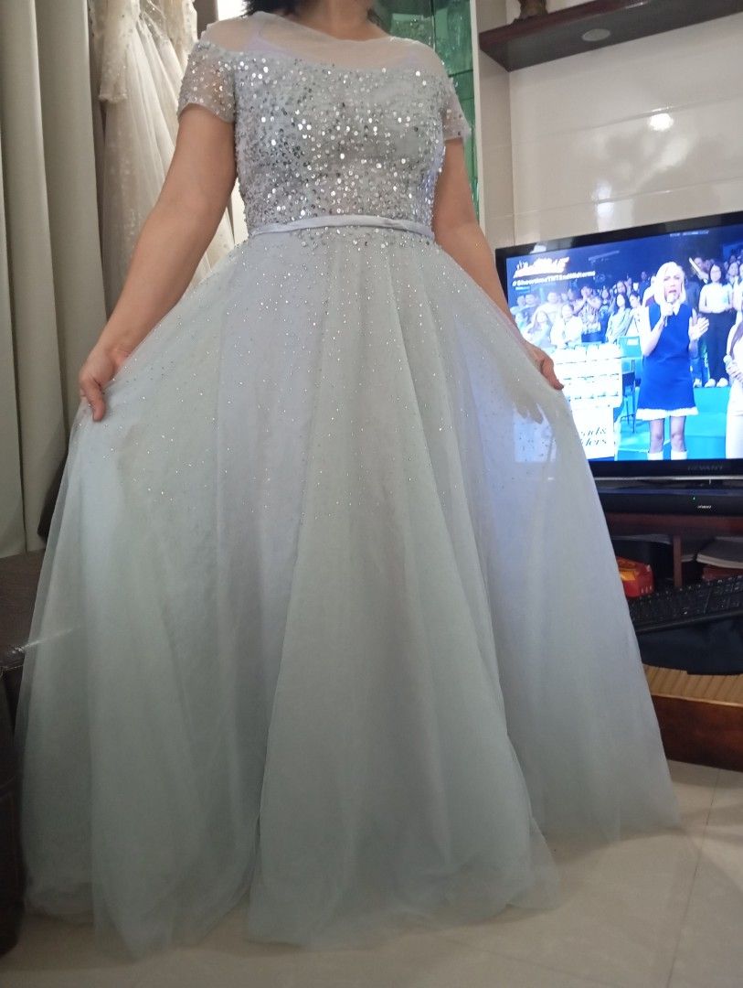 Pre loved Silver sequined long dress/gown (Category: Evening dresses & gowns) located in Quezon City. Submitted by esperanza_51 (Listing ID 1348795856, Image 2). Description: Silver long dress/gown. adjustable back. fits fr. small to large. up to 31 waist.