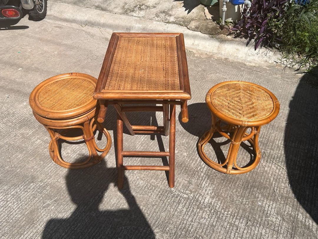 Rattan Foldable Table Set with 2 Stools (Category: Tables & Sets) located in General Trias. Submitted by tenshijapan (Listing ID 1348676453, Image 2). Description: Add a touch of rustic charm to your space with this beautiful rattan table set, perfect for both indoor and outdoor use. The set includes a unique foldable rattan table and two matching stools, designed with a timeless and stylish aesthetic. Whether you're hosting guests or enjoying a 