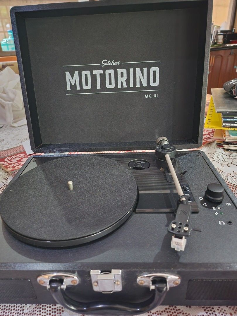 Satchmi motorino mk3 black turntable vinyls (Category: Portable Music Players) located in Manila. Submitted by topperware (Listing ID 1348700128, Image 1). Description: shows visible signs of aging. has rusts on some areas. stickers have been removed but may show some leftover marks. selling this along with some stacks of vinyls and giving away the cassette tapes for free. this is amateurly stored. sensitive buyers pls be advised!!!.
