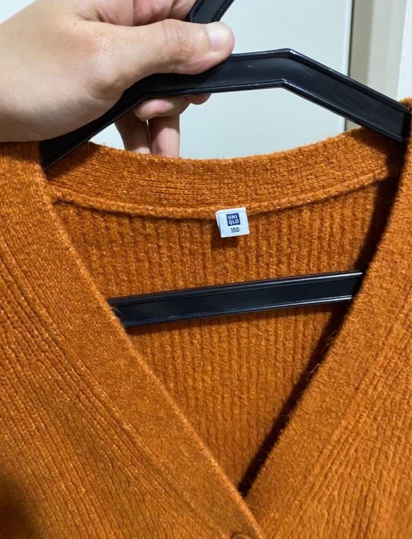 Uniqlo Cardigan (rust/orange) (Category: Longsleeves) located in Manila. Submitted by mailed (Listing ID 1348698209, Image 3). Description: Very comfortable! Size: 150 kids (can fit XS-S) .