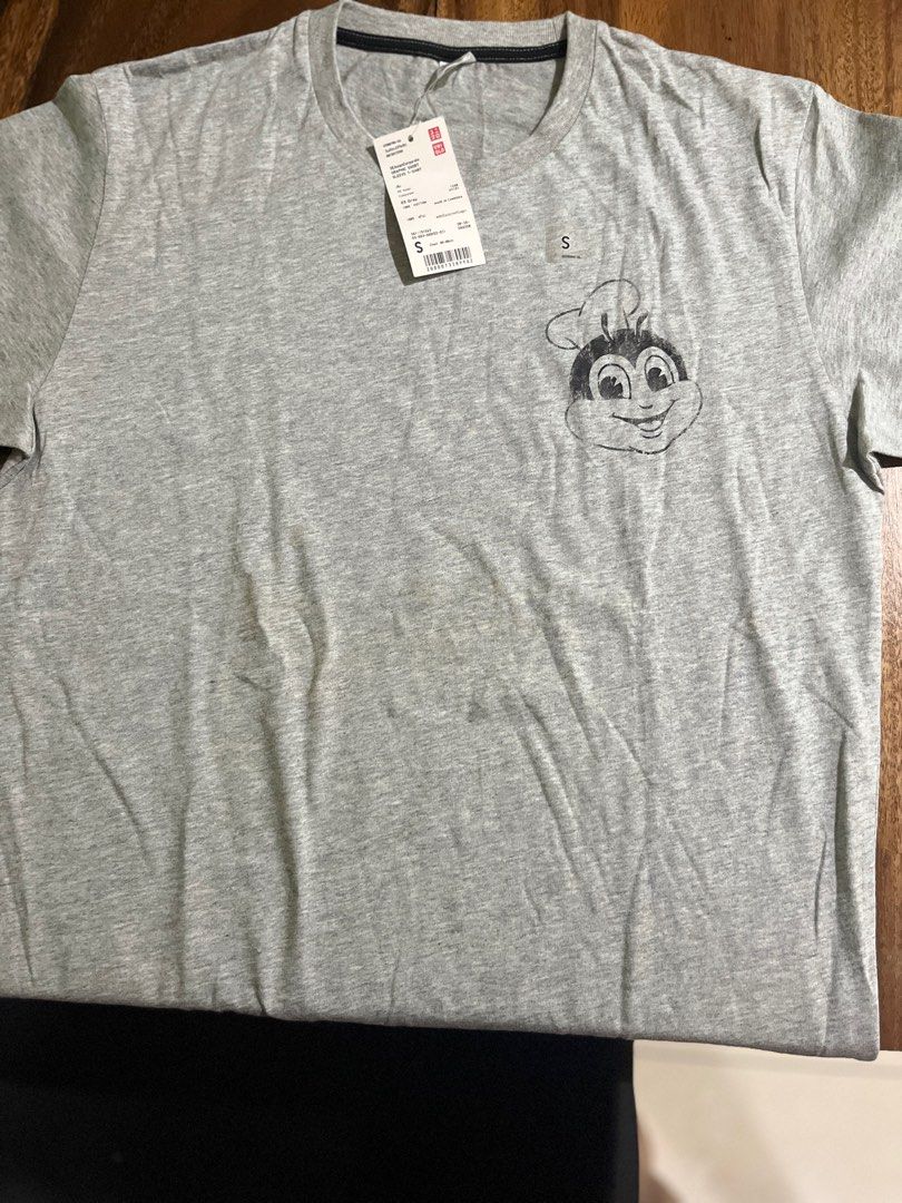 Uniqlo Jollibee Shirt (Category: Tshirts & Polo Shirts ) located in Quezon City. Submitted by mdsiazon (Listing ID 1348641731, Image 2). Description: Stored in the cabinet only. Still with tag. With storing stain but can be washed Small Pick up location Project 8 Quezon City.